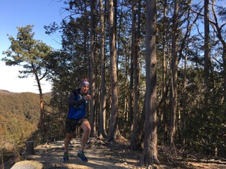 Man running on mountain trail