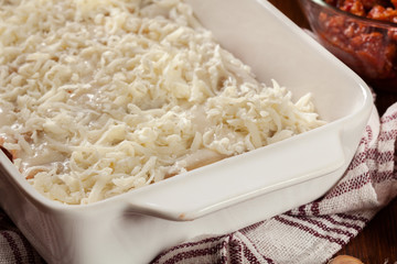 Cannelloni stuffed with meat cooked in a casserole dish ready for baking