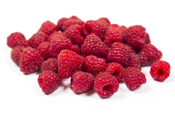 Fresh raspberry is isolated on a white background