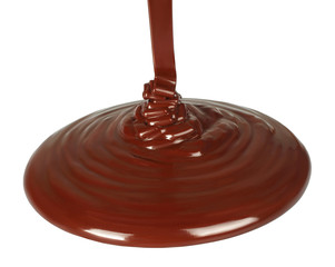 Melted chocolate dripping on white background