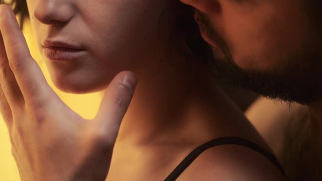 passion and sex between lovers :man touches sensually lips of his girlfriend