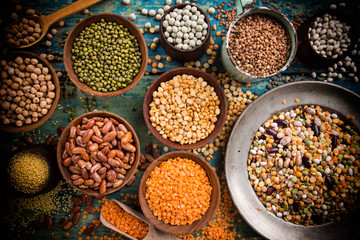 Raw legume on old rustic wooden table.