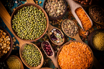 Raw legume on old rustic wooden table.