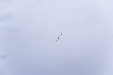 Air show in the sky above the Krasnodar airport flight school. Airshow in honor of Defender of the Fatherland. MiG-29 in the sky.