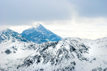 Fototapeta na wymiar Tatry mountains with snow-covered peaks in Poland.
