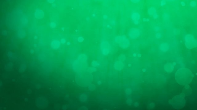 Abstract dark green background with floating particles. Seamlessly loopable animation.