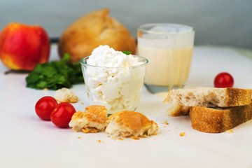 Cottage cheese, bread, crumb, tomato, apple, milk