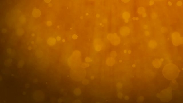 Abstract orange background with floating particles. Seamlessly loopable animation.