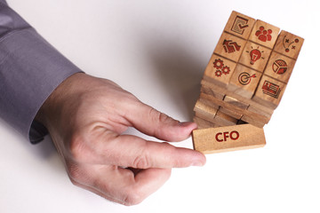 Business, Technology, Internet and network concept. Young businessman shows the word: CFO