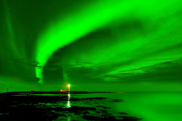 View of the northern light at Grotta Lighthouse in Reykjavik, Iceland.