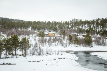 Obraz premium A beautiful wooden house in woods in Norway