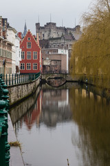 View of canals and  streets of Gent town, Belgium in rainy day in winter