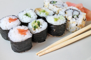 Set of sushi roll. Different types of sushes with chopstiks.