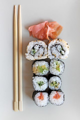 Set of sushi roll. Different types of sushes with chopstiks.