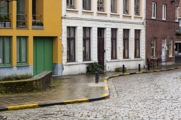 Architecture of streets of Gent town, Belgium in rainy day in winter