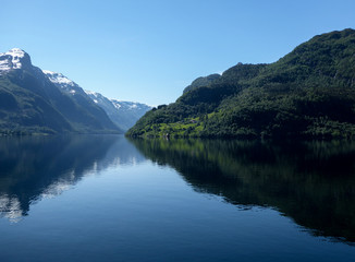 Fototapeta na wymiar Beautiful calm river winding through fjords
