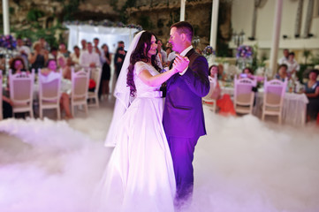 Awesome first wedding dance with smoke and rose purple lights.