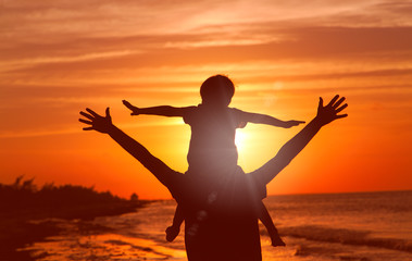 Fototapeta premium father and son having fun at sunset
