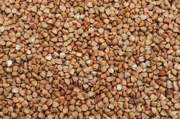 Buckwheat groats. Food background. Photo Wallpaper.