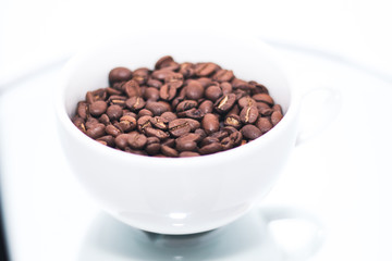 Coffee beans in white cup