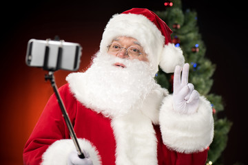 Santa Claus taking selfie