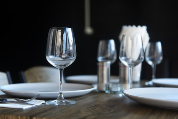 Tableware, glass plates and napkins at restaurant table