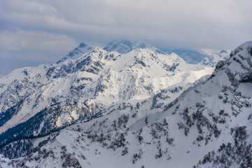 Fototapeta na wymiar Sochi, Krasnaya Polyana, Caucasus mountains snowy peaks