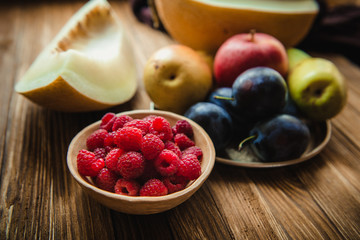 Assortment of fresh fruits and berries. Fruits plum, apple, pear.