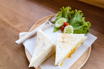 slice ham cheese egg sandwich breakfast with fresh vegetable