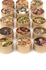closeup rows of organic herbal tea in tins