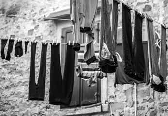 Fototapeta na wymiar Clothes hanging on ropes and drying