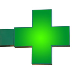 Pharmacy sign isolated. Green pharmacy cross with fixings for the wall.