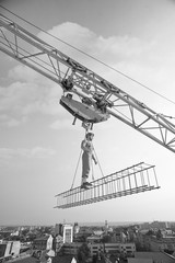 Professional builder dressed in vintage outfit posing on a cross