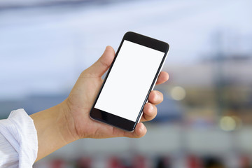 Man using smartphone at street night.
