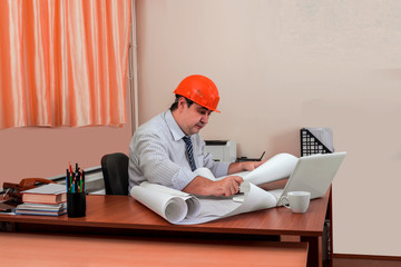 Construction manager checks the drawings