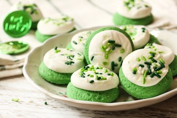 St Patrick day Green  frosted  Cookies with sprinkles, selective focus