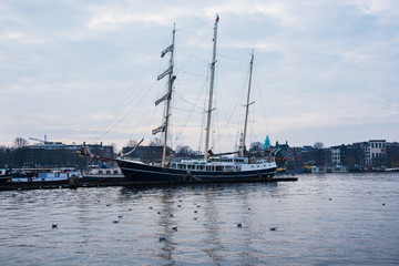 Fototapeta premium Ships on the canals in Amsterdam. City landscape. Winter season