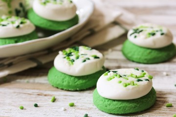 St Patrick day Green  frosted  Cookies with sprinkles, selective focus