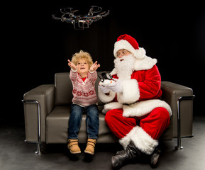 Santa Claus with child using hexacopter drone