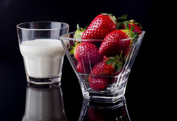 Fresh milk on the rich black background