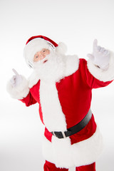 Santa Claus listening music with headphones