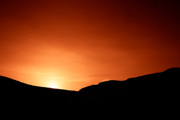A beautiful, artistic, colorful sunset in Norway above mountains