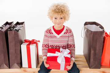 Happy child holding gift box