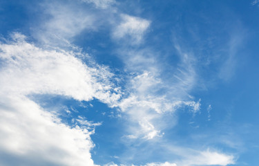 blue sky background with tiny clouds