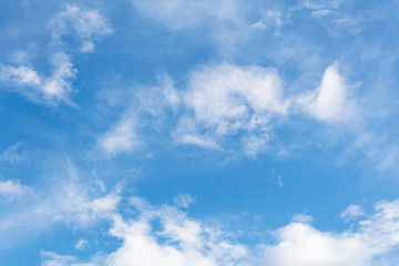 blue sky background with tiny clouds