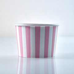 Classic pink and white striped cardboard food tub