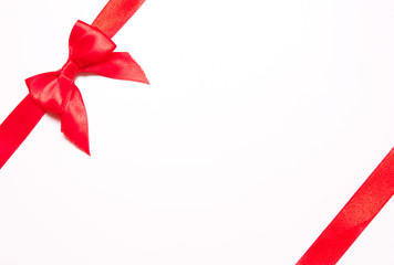 Red ribbons with bow with tails  on white background