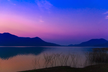 Sunrise sky over the lake in the morning. Thailand.