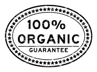 Grunge black 100 percent organic oval rubber seal stamp on white background