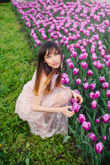 beautiful woman in a field of tulips